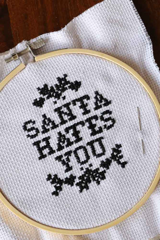 Close-up image of the Santa Hates You Sewing Kit