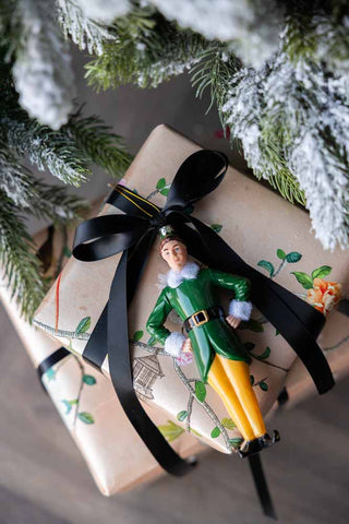 Lifestyle image of the Elf Christmas Decoration on a present
