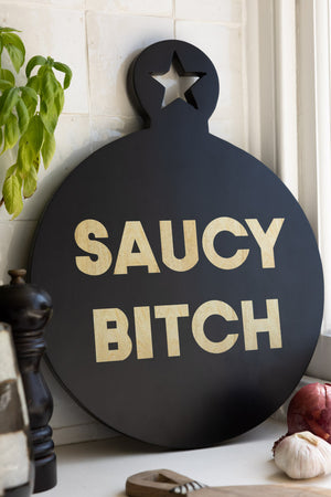 Lifestyle image of the Saucy Bitch Mango Wooden Serving Board