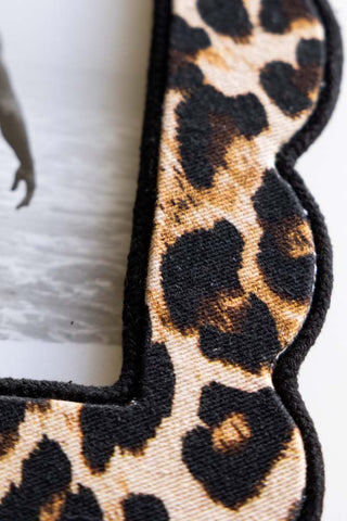 A close up detail of the leopard print pattern on the frame. 