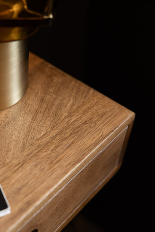 The corner of the Secret Nook Wall Shelf With Drawer. 