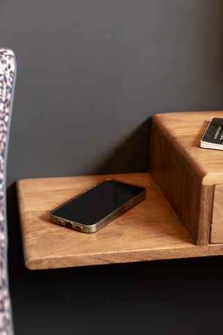 The shelf of the Secret Nook Wall Shelf With Drawer.