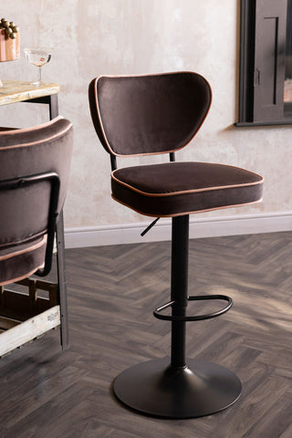 The Set Of 2 Adjustable Bar Stools in Chocolate Velvet styled next to a wooden island.