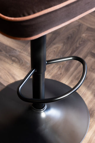 Close-up of the footrest on the Set Of 2 Adjustable Bar Stools in Chocolate Velvet.
