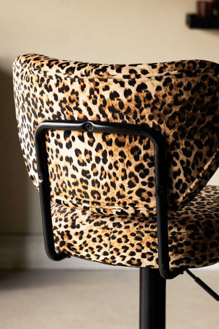 Close-up o f the reverse side of the Set Of 2 Adjustable Bar Stools in Leopard Print Velvet.