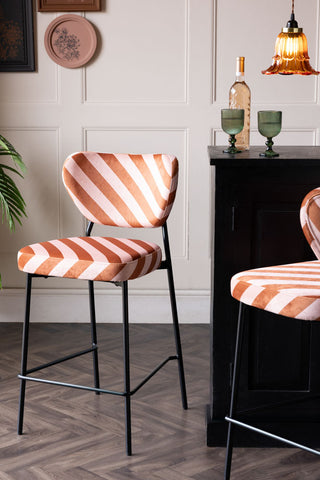 Lifestyle image of the Set Of 2 Bar Stools in Pink & Amber Stripe Velvet