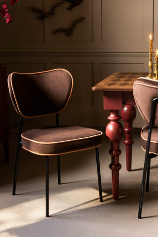 The Set Of 2 Dining Chairs in Chocolate Velvet styled with a dining table.