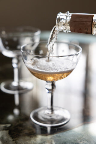 Detail image of the Set Of 2 Etched Star Champagne Glasses