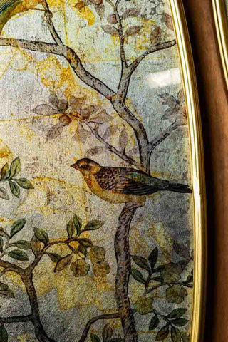 Close up detail of the bird pattern on the Set of 2 Framed Oval Chinoiserie Wall Hangings. 