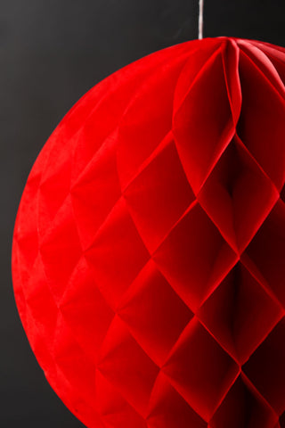 Close-up image of the Set Of 2 Red Honeycomb Ball Decorations