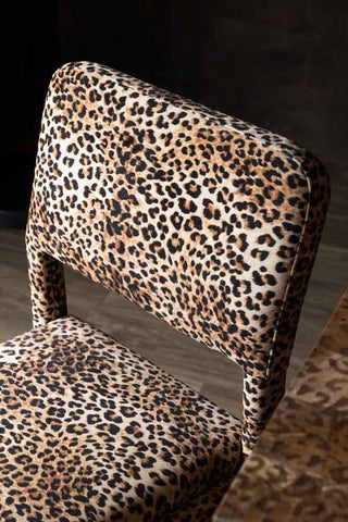 Close-up of the back of one of the Set Of 2 Signature Leopard Velvet Dining Chairs.