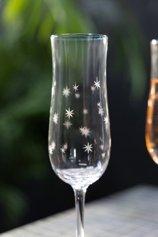 Close-up image of the Set Of 2 Etched Star Champagne Flutes