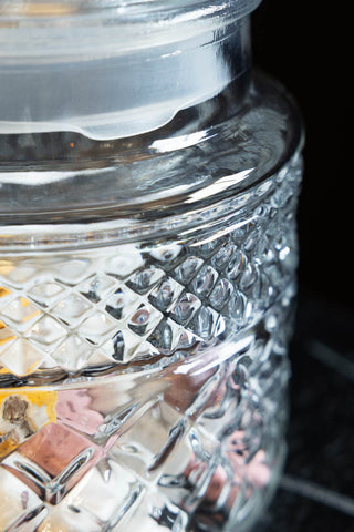 Close-up of one of the Set Of 2 Vintage-Style Glass Storage Jars.