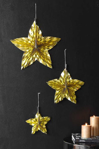Lifestyle image of the Set Of 3 Metallic Gold Paper Stars