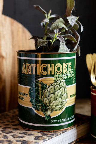 Image of the Set Of 3 Retro Deli Storage Tins with a plant