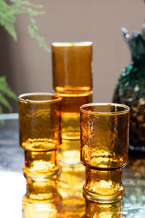 Lifestyle image of the Set Of 4 Stackable Amber Glass Tumblers