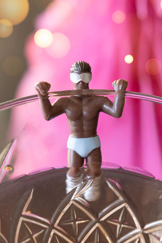 Image of Set Of 6 Apres Ski Wine Glass Charms holding onto a glass