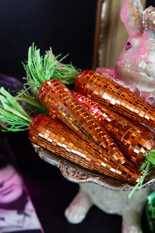 The Set Of 6 Disco Carrot Easter Decorations styled on a bunny butler decoration.