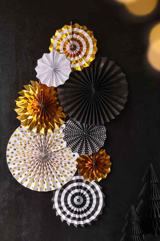 Lifestyle image of the Set Of 8 Black & Gold Paper Fan Decorations