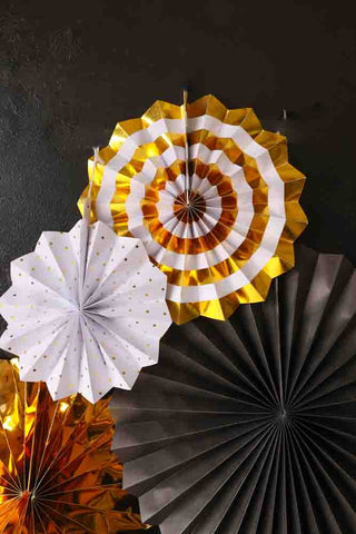 Close-up image of the Set Of 8 Black & Gold Paper Fan Decorations