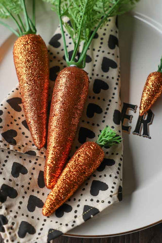 Close-up image of the Set Of 9 Glitter Carrot Decorations
