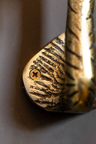 Detail shot of  one of the screw points for the Set of 2 Antique Gold Flamingo Head Coat Hooks.