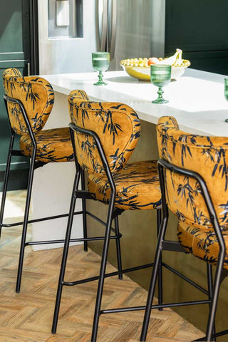 Three of the Bar Stools in Bamboo Velvet styled at a breakfast bar, seen from the back.