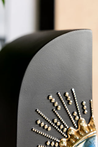 The curved top of the Set of 2 Black Mystic Eye Bookends. 