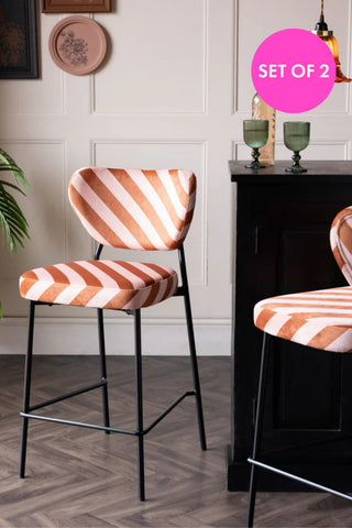 Lifestyle image of the Set Of 2 Bar Stools in Pink & Amber Stripe Velvet