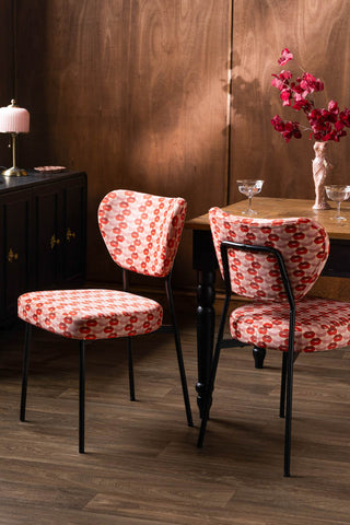 The Set of 2 Dining Chairs in Lips Print Velvet styled with a dining table and various accessories.