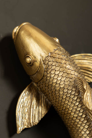 Close-up one of the Set of 2 Gold Koi Fish Wall Art on a black background.