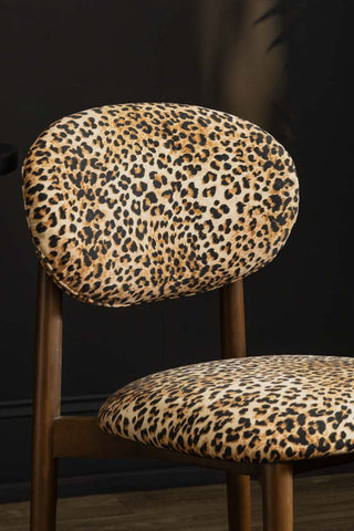 Close-up of one of the Set of 2 Leopard Wooden Dining Chairs.