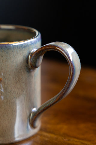 Image of the handle on the Set of 2 Milagro Heart Glazed Mugs