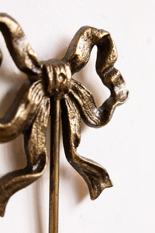 Close-up image of the Set of 2 Pretty Gold Bow Wall Hooks