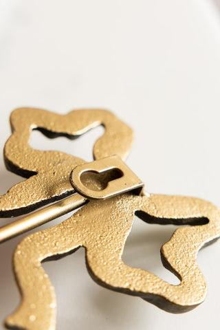 Image of the back of the Set of 2 Pretty Gold Bow Wall Hooks