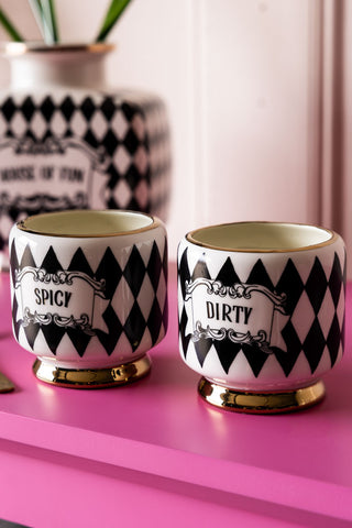 The Set of 2 Spicy & Dirty Cocktail Cups shown against a pink tabletop with a matching vase in the background. 