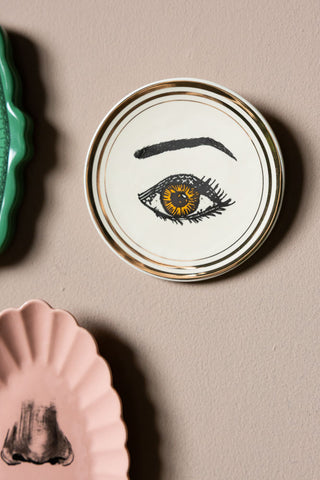 Close-up of one of the eye plates from the Set of 3 Colourful Face Wall Plates.