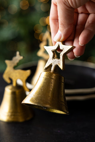 Image of someone holding the Set of 3 Gold Bell Christmas Ornaments