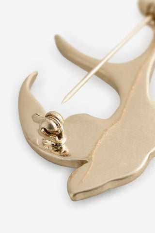 The pin on the back of the bird brooch from the Set of 3 Gold Stars & Birds Brooch Pack. 
