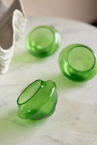 Close-up image of the Set Of 3 Green Glass Tea Light Holders