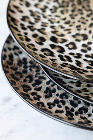 A detail shot of the black edge of the Set of 4 Leopard Print Dinner Plates. 