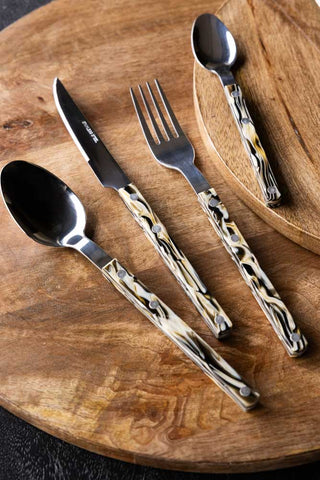 Lifestyle image of the Set of 4 Marble-Effect Cutlery Set