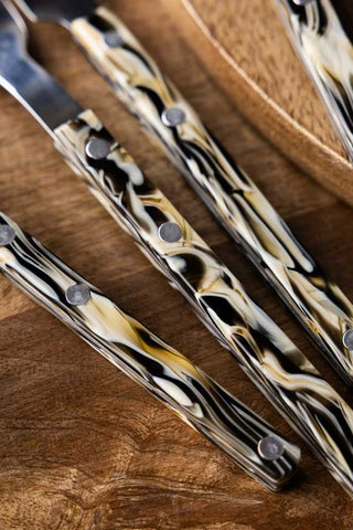 Close-up image of the Set of 4 Marble-Effect Cutlery Set