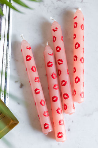 Lifestyle image of the Set of 4 Red Lips Print Dinner Candles