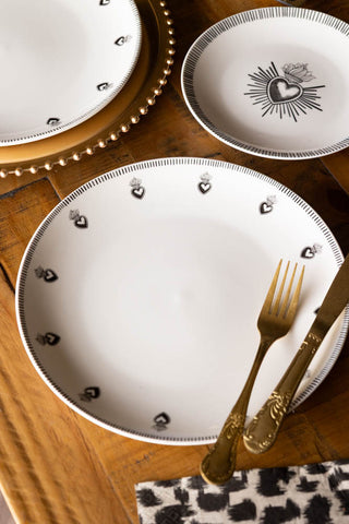Lifestyle image of the Set of 4 White Dinner Plates with Heart Edge Detail