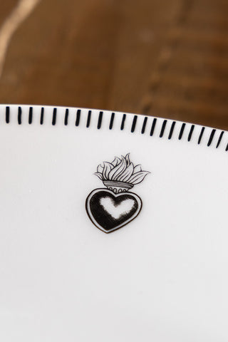 Close-up image of the Set of 4 White Dinner Plates with Heart Edge Detail
