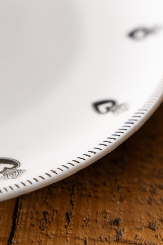 Image of the finish on the Set of 4 White Dinner Plates with Heart Edge Detail