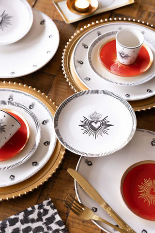 Image of the Set of 4 White Dinner Plates with Heart Edge Detail on a table setting