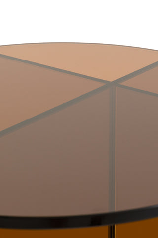 Close-up of the top of the Seventies Amber Glass Side Table in front of a white background.