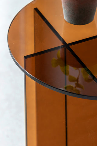 Close-up of the top of the Seventies Amber Glass Side Table.